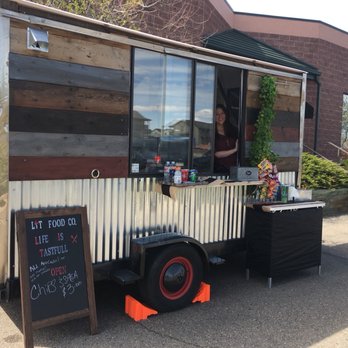 Lit Food Co. - a woman behind a food truck - Tacos Near Me Lit Food Co. - a woman behind a food truck - Tacos Near Me