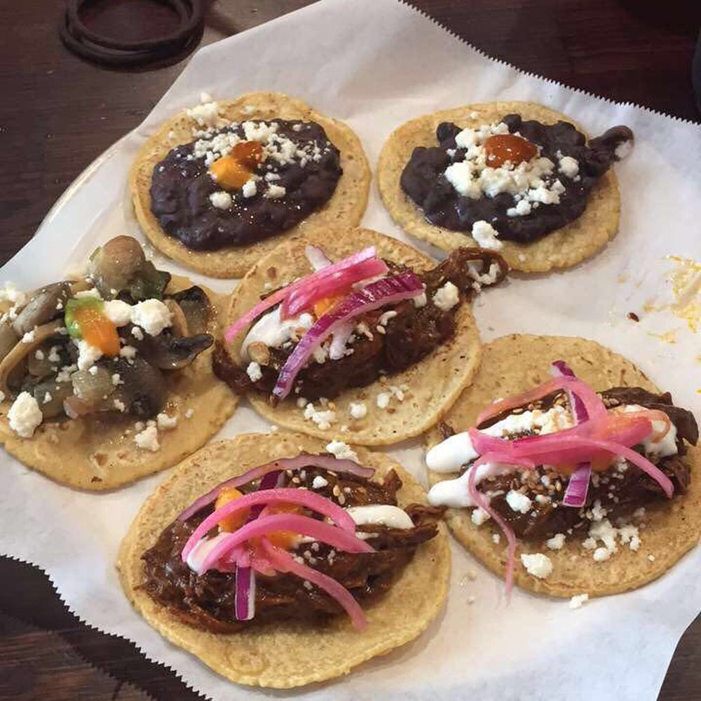 Guisados - Sampler with frijoles and queso, mole poblano, and mushrooms and cilantro. - Tacos Near Me - Burbank, California