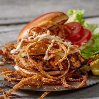 Famous Dave's Bar-B-Que - ows grilled chicken sandwich with onion rings - Barbeque Near Me - Laurel, Maryland Famous Dave's Bar-B-Que - ows grilled chicken sandwich with onion rings - Barbeque Near Me - Laurel, Maryland