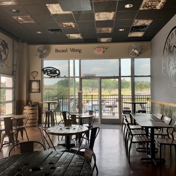 Buzzed Viking Brewing Company - Indoor seating area (more in back of me as well) - Breweries Near Me - Concord, North Carolina