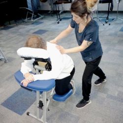 Sunny Soul Massotherapy - Cate working a school event for staff wellness and appreciation day.