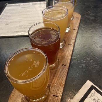 Big Ditch Brewing - Flight - listed closest to farthest: hayburner, cinnamon apple, day burner, pina colada, & steampunk cider - New American Near Me - Buffalo, New York Big Ditch Brewing - Flight - listed closest to farthest: hayburner, cinnamon apple, day burner, pina colada, & steampunk cider - New American Near Me - Buffalo, New York
