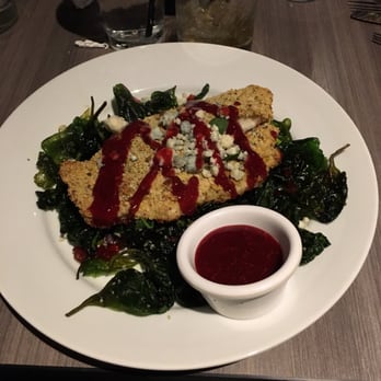 Bella Milano - Pistachio crusted Tilapia w/ a raspberry chipotle sauce, blue cheese crumbles, Extra sauce, flash fried spinach with prosciutto crumbles. - Italian Near Me - Edwardsville, Illinois