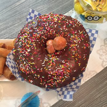 World's Fare Donuts - Giant donut with a chocolate glaze and sprinkles. Even came with some donut holes! Yum! - Donuts Near Me - Hayward, California World's Fare Donuts - Giant donut with a chocolate glaze and sprinkles. Even came with some donut holes! Yum! - Donuts Near Me - Hayward, California