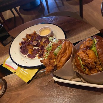 Double Chicken Please - The chips on the left, burger on the left was the duck salted egg, on the right is the hot honey - Cocktail Bars Near Me - New York, New York