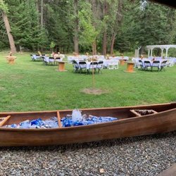 Rustic River Wedding & Venue - Front yard for reception and canoe for drinks