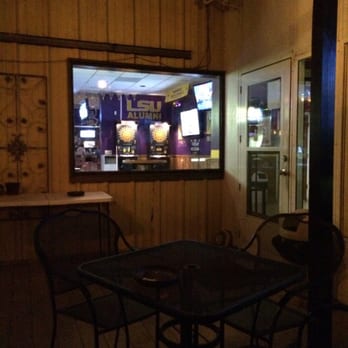 Cordova Lanes - Back patio with two big screen televisions to watch your favorite sports game. - Bowling Near Me - Pensacola, Florida