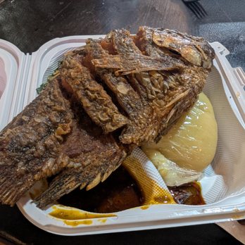 Latha African Style Bbq - packet of plantain fufu under the fish; collard greens are hiding - Barbeque Near Me - Portland, Oregon Latha African Style Bbq - packet of plantain fufu under the fish; collard greens are hiding - Barbeque Near Me - Portland, Oregon