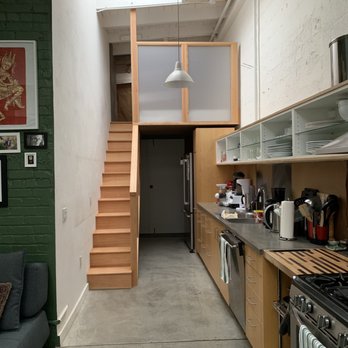 Beyond Green Construction - AFTER: The kitchen with the brand new staircase with extended loft - General Contractors Near Me