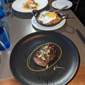 Bourbon Steak - 8oz Rib eye Pave, Kimchi Fried rice and Seabass - Steakhouses Near Me - Scottsdale, Arizona Bourbon Steak - 8oz Rib eye Pave, Kimchi Fried rice and Seabass - Steakhouses Near Me - Scottsdale, Arizona