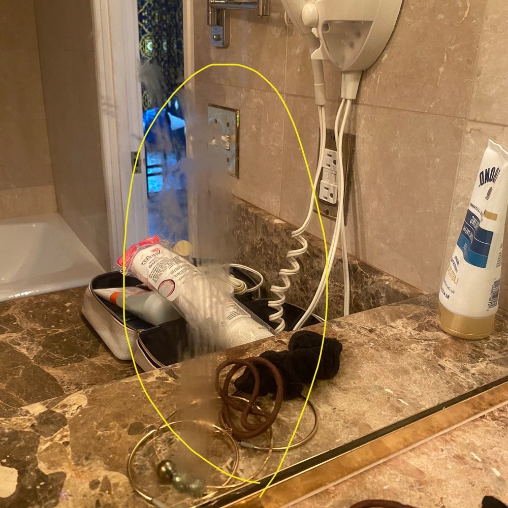 Ali'i Beach Rentals - Dirty bathroom mirror. Shower floor was really dirty too but didn't show in a photo - Property Management Near Me - Honolulu, Hawaii