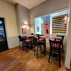 PAUL French Bakery & Cafe - Tysons Galleria - Countertop seating facing the mall interior. The doorway leads to the parking garage.