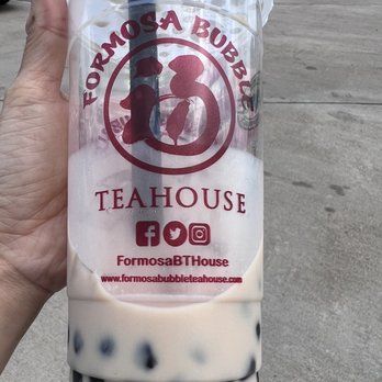 Formosa Bubble Teahouse - a hand holding a cup of bubble tea - Bubble Tea Near Me - Cypress, Texas
