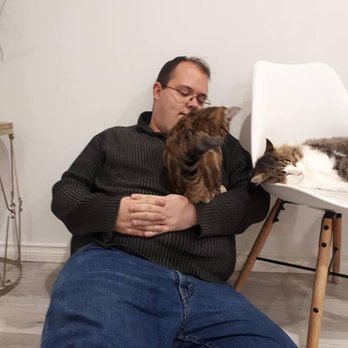 Cat Cafe on Whyte - My boyfriend made some new friends on our visit to cat cafe - Coffee & Tea Near Me - Edmonton, Alberta
