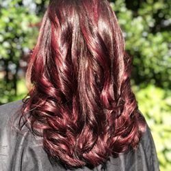 Evangelin A Boutique Salon - Deep plum highlights on rich chocolate brown color.