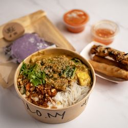 Sira Ulo - Rice noodle veggie bowl, chicken skewer, lumpia, and brownie with ube icing.