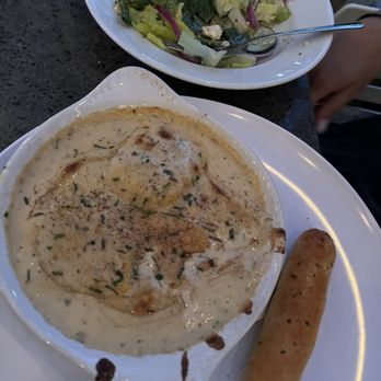 Pane E Vino Pizzeria - Butternut squash ravioli and Greek salad without the artichokes and olives - Italian Near Me - Huntsville, Alabama