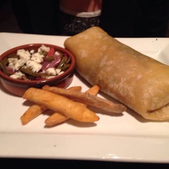Lucha Restaurant - Veggie burrito with included cactus side salad and plantain fries. - Mexican Near Me - St. Louis, Missouri Lucha Restaurant - Veggie burrito with included cactus side salad and plantain fries. - Mexican Near Me - St. Louis, Missouri