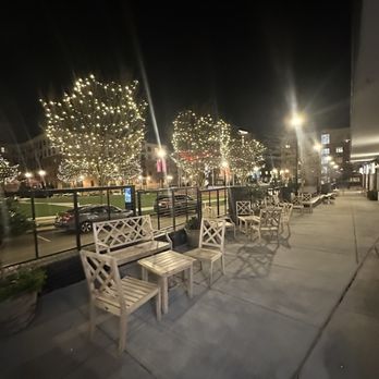 Vita Vite Midtown - a row of park benches at night - Wine Bars Near Me - Raleigh, North Carolina