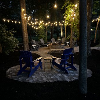 Gordon's Lawn & Landscape - a patio with string lights - Landscaping Near Me