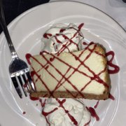 Photo of Frank Guido's Little Italy - Kingston, NY, United States. NY Style Cheesecake with Raspberry Drizzle