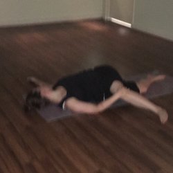 The Yoga Mate - Student in simple twist. Continuing to open up the spine.