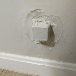 Cape Winds Resort - Four wire phone jack with at least five layers of paint on it.