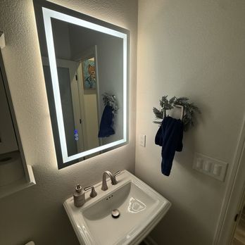 Hero Electric - After. Repaired dry wall. Additional motion switch. Outlet behind mirror - Electricians Near Me Hero Electric - After. Repaired dry wall. Additional motion switch. Outlet behind mirror - Electricians Near Me