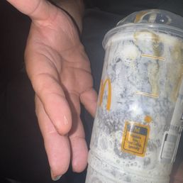 The little piece of glass on his finger was inside of the drink The little piece of glass on his finger was inside of the drink
