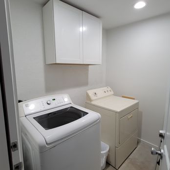 S & M Service - a laundry room with a washer and dryer - General Contractors Near Me S & M Service - a laundry room with a washer and dryer - General Contractors Near Me