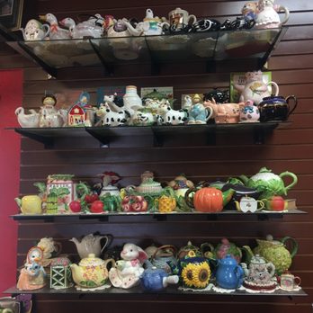 StorieBook Cafe - Some of the adorable teacup and tea kettle collection - Delis Near Me - Glen Rose, Texas