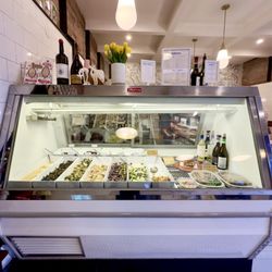 Stellina Alimentari - Cold case containing fresh scooped 'sides' & desserts.