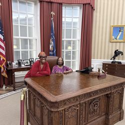 My mother and I at the Presidential Oval Office desk
