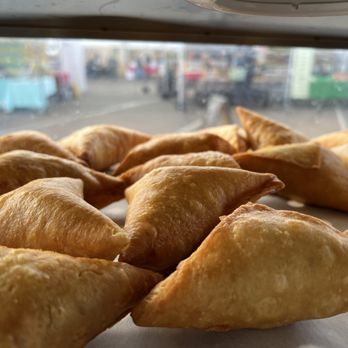 Hoyos cuisine - a pile of pastries on a table - African Near Me