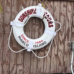 a life preserver hanging on a wall a life preserver hanging on a wall