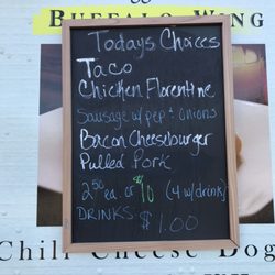 This Is How We Roll Food Truck - Daily Menu is posted on side of truck