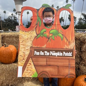 CVS Pharmacy - a child holding a pumpkin patch sign - Drugstores Near Me - Pasadena, California