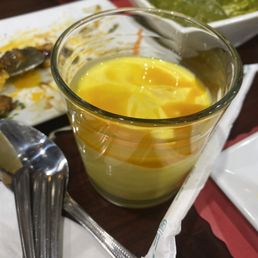 Half of a mango lassi (amazing portion!)
