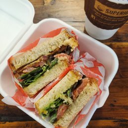 a sandwich in a styrofoam container