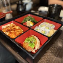 Benkay Japanese Restaurant & Sushi Bar - Four item combo with gyoza, chicken teriyaki, California roll, seaweed salad.