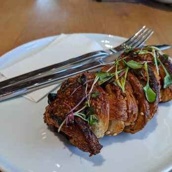 1900 Barker Bakery And Cafe - a piece of steak on a plate with a fork and knife - Coffee & Tea Near Me - Lawrence, Kansas
