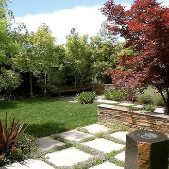 Myers Landscape - a garden with a stone path - Landscaping Near Me Myers Landscape - a garden with a stone path - Landscaping Near Me