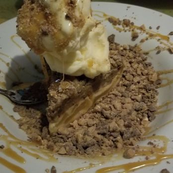 Flanigan's - Hallandale - Flanigan Shenanigan, vanilla ice cream on top an apple pie covered with caramel and alot of heath bar crunch - American Near Me - Hallandale Beach, Florida Flanigan's - Hallandale - Flanigan Shenanigan, vanilla ice cream on top an apple pie covered with caramel and alot of heath bar crunch - American Near Me - Hallandale Beach, Florida
