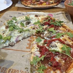 Build your own pizza - half white sauce/half spicy red sauce And a carnivore pizza with extra toppings Build your own pizza - half white sauce/half spicy red sauce And a carnivore pizza with extra toppings