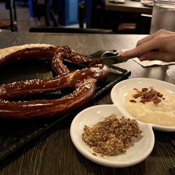 7 South Bottle + Kitchen - Giant pretzel served with beer cheese sauce and heavy mustard.  Very good!  I crave another one. - Gastropubs Near Me - Natick, Massachusetts