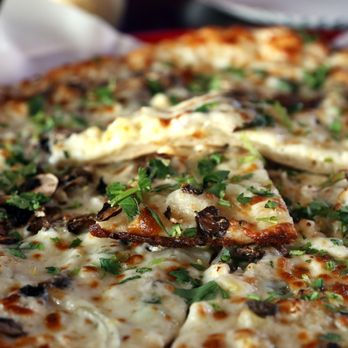 Sliver Pizzeria - Corn, cremini mushroom, green scallion, yellow onion, cheese, lemon-zest cilantro, garlic olive oil... - Pizza Near Me - Oakland, California Sliver Pizzeria - Corn, cremini mushroom, green scallion, yellow onion, cheese, lemon-zest cilantro, garlic olive oil... - Pizza Near Me - Oakland, California