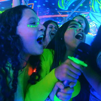 Party Buses 4 U - Teens doing karaoke at a birthday party on the Retro Neon. - Party Bus Rentals Near Me Party Buses 4 U - Teens doing karaoke at a birthday party on the Retro Neon. - Party Bus Rentals Near Me