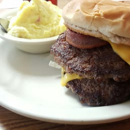 Delicious 2/3 lb bacon cheeseburger. Cooked to perfection. You will leave full and happy. The toppings are on bottom. Delicious 2/3 lb bacon cheeseburger. Cooked to perfection. You will leave full and happy. The toppings are on bottom.
