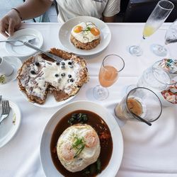 Kapolei Golf Club Restaurant - Loco Moco, Blueberry Cheesecake is pancake, and fried rice. Two mimosas, guava and pineapple, and an iced coffee.