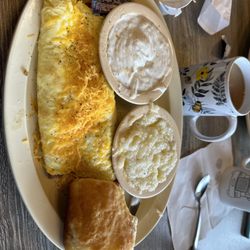 Busy Bee Cafe - Meat lover's omelette, grits, and biscuit and gravy!